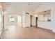 Bright living room featuring a vaulted ceiling and wood-look floors at 8843 W Phillips Dr, Littleton, CO 80128