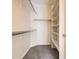Spacious walk-in closet with shelves and closet rod at 8843 W Phillips Dr, Littleton, CO 80128