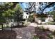 Charming front exterior with walkway, mature trees, and landscaped front yard at 3823 Castle Butte, Castle Rock, CO 80109
