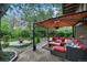 Backyard featuring a stylish outdoor lounge with ample seating and a fire pit for cozy gatherings at 1415 S Jasmine Way, Denver, CO 80224