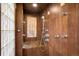 A beautifully tiled shower featuring both traditional and rainfall shower heads at 1415 S Jasmine Way, Denver, CO 80224