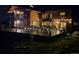 An amazing log home back deck complete with lights and plenty of room to entertain guests at 6241 Kilimanjaro Dr, Evergreen, CO 80439