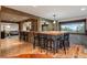 Entertainment space featuring a spacious bar area with seating and wood accents at 6241 Kilimanjaro Dr, Evergreen, CO 80439