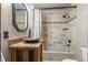 Bathroom featuring a granite vanity, bronze sink, a tiled shower, and tub combo at 6241 Kilimanjaro Dr, Evergreen, CO 80439