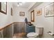 Stylish bathroom with rustic vanity, unique tiling, and modern fixtures at 6241 Kilimanjaro Dr, Evergreen, CO 80439