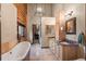 Spacious bathroom features a soaking tub, custom cabinets, and designer fixtures at 6241 Kilimanjaro Dr, Evergreen, CO 80439