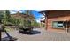 Outdoor deck featuring a large patio umbrella, dining table, and views of trees at 6241 Kilimanjaro Dr, Evergreen, CO 80439