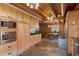 Well-lit kitchen showcasing wooden cabinets, stainless steel appliances, and dining area at 6241 Kilimanjaro Dr, Evergreen, CO 80439