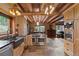 Beautiful kitchen featuring stainless steel appliances, custom cabinets, and a large farmhouse sink at 6241 Kilimanjaro Dr, Evergreen, CO 80439