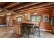 Charming kitchen with custom cabinets, granite countertops, and a stylish island with seating at 6241 Kilimanjaro Dr, Evergreen, CO 80439