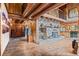 Stunning log home interior featuring a stone fireplace, wood floors, and rustic charm throughout at 6241 Kilimanjaro Dr, Evergreen, CO 80439