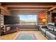 Comfortable living room featuring rustic log walls, hardwood floors, and a mountain view at 6241 Kilimanjaro Dr, Evergreen, CO 80439