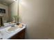 Cozy bathroom features a vanity with a sink and a mirror creating a functional and inviting space at 1732 S Blackhawk Way # D, Aurora, CO 80012