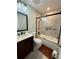 Updated bathroom featuring tiled shower over tub, modern vanity, and sleek black fixtures at 1732 S Blackhawk Way # D, Aurora, CO 80012