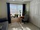 Bright bedroom featuring a work desk, many plants, and a large closet at 1732 S Blackhawk Way # D, Aurora, CO 80012