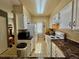 Bright kitchen features white cabinets, modern appliances and great lighting for functionality and style at 1732 S Blackhawk Way # D, Aurora, CO 80012