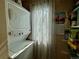 Compact laundry room with a stacked washer and dryer, providing functionality in a small space at 1732 S Blackhawk Way # D, Aurora, CO 80012