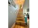 Stylish staircase leads to the upper level, complemented by hardwood flooring and modern railing at 1732 S Blackhawk Way # D, Aurora, CO 80012