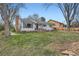 Charming single-Gathering home with a well-maintained lawn, inviting curb appeal, and blooming flower beds at 2481 Garrison St, Lakewood, CO 80215