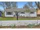 Inviting single-Gathering home with a white picket fence and meticulously landscaped front yard at 2481 Garrison St, Lakewood, CO 80215