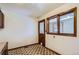 A hallway featuring a distinctive door with a pet door, and geometric linoleum at 2481 Garrison St, Lakewood, CO 80215