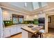 Kitchen features skylight, bright white cabinetry, wooden countertop, and stainless appliances at 2481 Garrison St, Lakewood, CO 80215