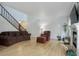 Living room featuring hardwood floors, fireplace, and ample natural light at 4624 S Newton St, Denver, CO 80236