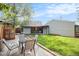 Lush backyard featuring a patio, green lawn, and a charming pergola at 2595 S Irving St, Denver, CO 80219