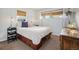 Cozy bedroom showcasing warm wood flooring and natural lighting at 2595 S Irving St, Denver, CO 80219