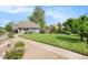 Charming single Gathering home with a well manicured front yard with mature trees and landscaping at 2595 S Irving St, Denver, CO 80219