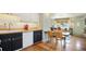 Bright kitchen with butcher block counters, white cabinets, and wood floors at 2595 S Irving St, Denver, CO 80219
