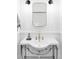 Charming bathroom with modern mirror, bright vanity, and classic fixtures at 2909 Glenarm Pl, Denver, CO 80205