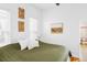 Bright bedroom with natural light, clean white walls, and rustic decorative elements at 2909 Glenarm Pl, Denver, CO 80205