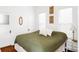 Comfortable bedroom with hard wood floors, natural light, and warm artistic decor at 2909 Glenarm Pl, Denver, CO 80205