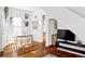 Bright dining room with hardwood floors and a wooden table with white chairs at 2909 Glenarm Pl, Denver, CO 80205