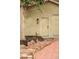 Side view of the garage door with a quaint stone pathway and manicured mulch beds at 2909 Glenarm Pl, Denver, CO 80205