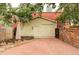 Detached garage with brick-paved driveway offering convenient parking and storage solutions in the backyard at 2909 Glenarm Pl, Denver, CO 80205