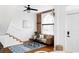 Bright living room boasting exposed brick, hardwood floors, and an inviting seating area at 2909 Glenarm Pl, Denver, CO 80205
