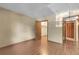 Empty bedroom featuring hardwood floors, a window, a closet, and neutral walls at 8225 Fairmount Dr # 102, Denver, CO 80247
