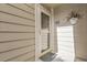 Inviting condo front door with stylish accents and easy access at 8225 Fairmount Dr # 102, Denver, CO 80247