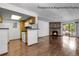 Open living space with a kitchen, living room and fireplace at 8225 Fairmount Dr # 102, Denver, CO 80247