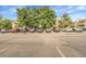 Condo complex parking lot with ample spaces available for residents and guests at 8225 Fairmount Dr # 102, Denver, CO 80247