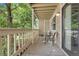 Covered patio with room for seating and a table to enjoy the outdoors at 8225 Fairmount Dr # 102, Denver, CO 80247
