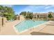 Community pool with lounge chairs perfect for relaxation and enjoying the outdoors at 8225 Fairmount Dr # 102, Denver, CO 80247