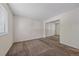 Bright bedroom with mirrored closet doors and a window at 8438 Everett Way # B, Arvada, CO 80005