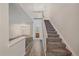 Spacious entryway featuring wood-style floors, a staircase to the upper level, and access to the living area at 8438 Everett Way # B, Arvada, CO 80005
