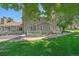 Charming home featuring a well-maintained front yard, a white picket fence, and an inviting porch at 8438 Everett Way # B, Arvada, CO 80005