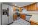 Well-equipped kitchen with stainless steel appliances, wood cabinetry, and lots of counter space at 8438 Everett Way # B, Arvada, CO 80005