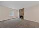 Spacious living room with a stone fireplace and carpet at 8438 Everett Way # B, Arvada, CO 80005