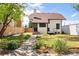 Charming home featuring a well-manicured lawn, tidy landscaping, and inviting curb appeal at 1484 Cherry St, Denver, CO 80220